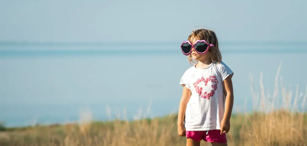 Image of child at beach, outside actiivty as part of kids' health